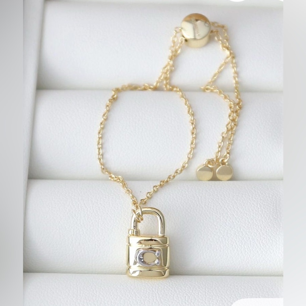 COACH Signature Padlock Slider Bracelet Gold/Silver/ new .